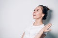 Enjoying the sound. Portrait of happy young woman with white earphones is listening music Royalty Free Stock Photo