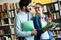 Enjoying student life. Smiling young happy students couple studying and having fun together