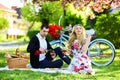 Enjoying summer rest. happy family in summer park. food and drink. man and woman. romantic couple on picnic. love date