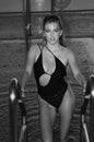 Enjoying summer vacation. Swimsuit swimwear model woman on pool luxury resort vacation. Fashion for wellness spa Royalty Free Stock Photo