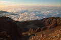 Enjoying sunrise view at summit top in high mountain volcano Rinjani. Island Lombok, Indonesia. Royalty Free Stock Photo