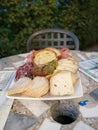 Enjoying a tasty plate of cheeses and cured meats