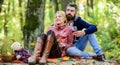 Enjoying their perfect date. Happy loving couple relaxing in park together. Romantic picnic with wine in forest. Couple Royalty Free Stock Photo