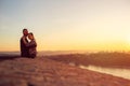 Enjoying time together. man and woman hugging at sunset