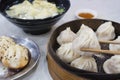 Enjoying traditional Shanghai food including dumpling, wonton and xiaolongbao Royalty Free Stock Photo