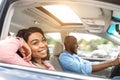 Happy black couple enjoying long drive on a car Royalty Free Stock Photo