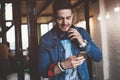 Enjoying work and good music. Cheerful young man in headphones listening to the music Royalty Free Stock Photo