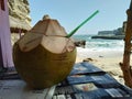 enjoying young coconuts by the beach