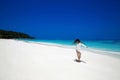 Enjoyment. Carefree happy woman open arms on tropical beach, exotic island. Summer vacation. Brunette girl model resting by sea. Royalty Free Stock Photo