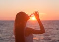 Enjoyment - free happy woman enjoying sunset.