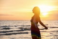 Enjoyment - free happy woman enjoying sunset. Royalty Free Stock Photo