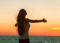 Enjoyment - free happy woman enjoying sunset. Royalty Free Stock Photo