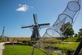 Enkhuizen, Netherlands. June 2022. The countryside with the mill at the Zuiderzee Museum in Enkhuizen.