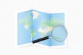 Enlarge Micronesia with a magnifying glass on a folded map of the world