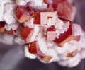 Enlarged red vanadinite crystals with white calcite from Milbladen, Morocco