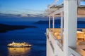 Enlighted cruise ship after sunset near Fira town at Santorini island, Greece Royalty Free Stock Photo