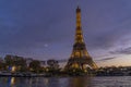 Enlightened Eiffel Tower During Blue Hour in Paris With Moon in a Colorful Sky