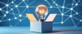 Enlightened Innovation Glowing Light Bulb Emerging from Box on Blue Network Background - Creative Technology Concept. Royalty Free Stock Photo