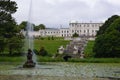 Enniskerry, Ireland: Powerscourt Gardens, the Triton Lake and the mansion Royalty Free Stock Photo