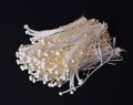 Enoki mushrooms over black