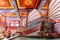 Enormous Chinese junk displayed in department store with colorful Chinese ceiling decorated with tourists in Dubai
