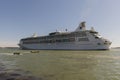 Enormous cruise ship sailing beside Venice in Italy.