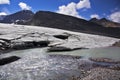 Enormous thawing glacier. A stream of thawed snow