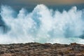 An enormous wave crashing against the rocks at Storms River Mouth, South Africa Royalty Free Stock Photo