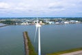 Enormous windmills stand in the sea along a dutch sea. FryslÃÂ¢n wind farm, the largest inland wind farm in the world.