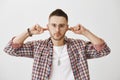 Enough of your excuses, I am done with you. Portrait of angry or annoyed young man with beard, wearing trendy glasses Royalty Free Stock Photo