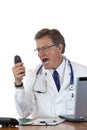 Enraged chief doctor screams loud into phone Royalty Free Stock Photo