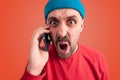 Enraged yelling man holding cell phone near his ear Royalty Free Stock Photo