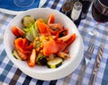 Ensalada de gambas - salad with salmon, shrimp and vegetables. Spanish cuisine