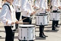 The ensemble of drummers in white ceremonial dress