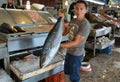 Ensenada, Mexico-August 5, 2014-Fisherman displaying his catch in a market