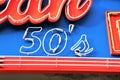 Ensign of a restaurant called `American Diner 50`. In typical 50s style.