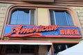 Ensign of a restaurant called `American Diner 50`. In typical 50s style.