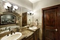The en-suite bathroom vanity in a modern upscale custom built home. Royalty Free Stock Photo
