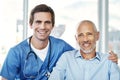 He ensures that Im well taken care of. Portrait of a male nurse caring for a senior patient. Royalty Free Stock Photo