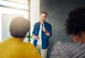 Ensuring that everyone understands their business strategy. a businessman giving a presentation to his colleagues in a Royalty Free Stock Photo