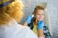 Ent doctor or Otolaryngologist examining a kid ear Royalty Free Stock Photo