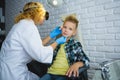 Ent doctor or Otolaryngologist examining a kid ear Royalty Free Stock Photo