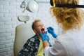 Ent doctor or Otolaryngologist examining a kid throat Royalty Free Stock Photo