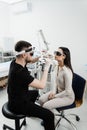 ENT doctor in protective glasses holding surgical laser and doing laser treatment inflammation of the nasal lining Royalty Free Stock Photo