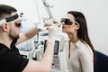 ENT doctor in protective glasses holding surgical laser and doing laser treatment inflammation of the nasal lining Royalty Free Stock Photo