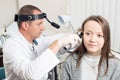 ENT physician looking into patient`s ear with an instrument. private clinic. otolaryngologist