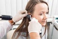 ENT physician looking into patient`s ear with an instrument. private clinic. otolaryngologist Royalty Free Stock Photo