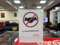 Sign in the EBB airport lounge for a No Handshake Zone, leftover from the COVID-19 pandemic Royalty Free Stock Photo
