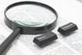 Enter and Backspace Computer Keys and a Lens on a Book Page Royalty Free Stock Photo