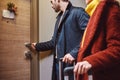 Enter in hotel room. Close-up of young couple near the hotel room Royalty Free Stock Photo